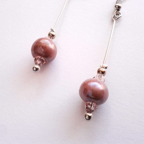 Boucles d'oreilles nébuleuse, en céramique rose.